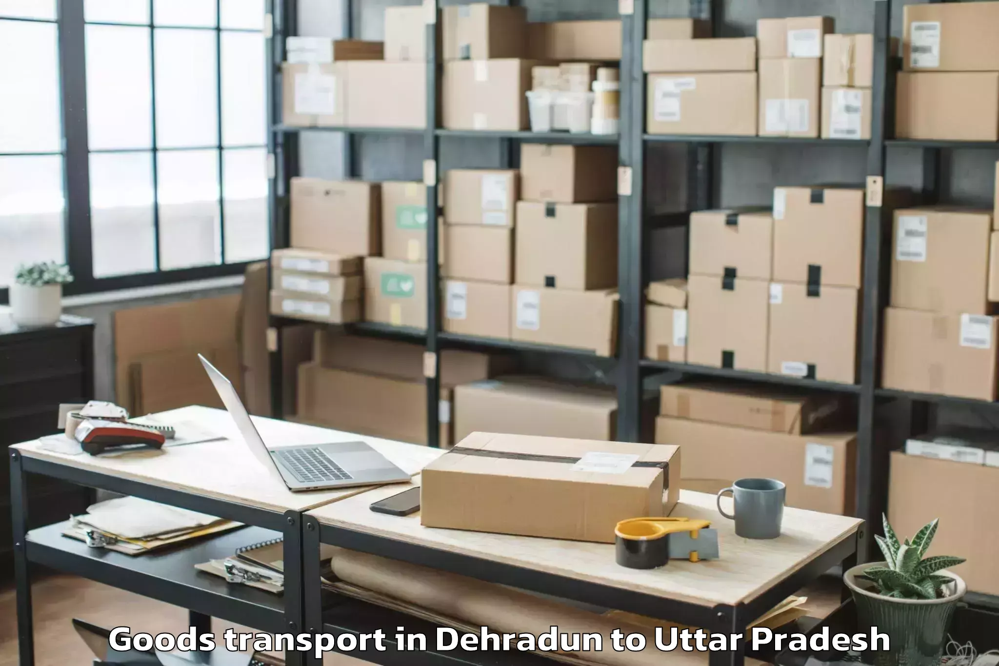 Professional Dehradun to Bansdih Goods Transport